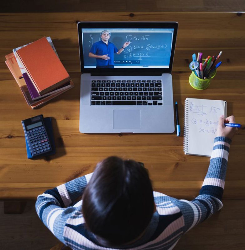 Students studying Spanish with online learning support